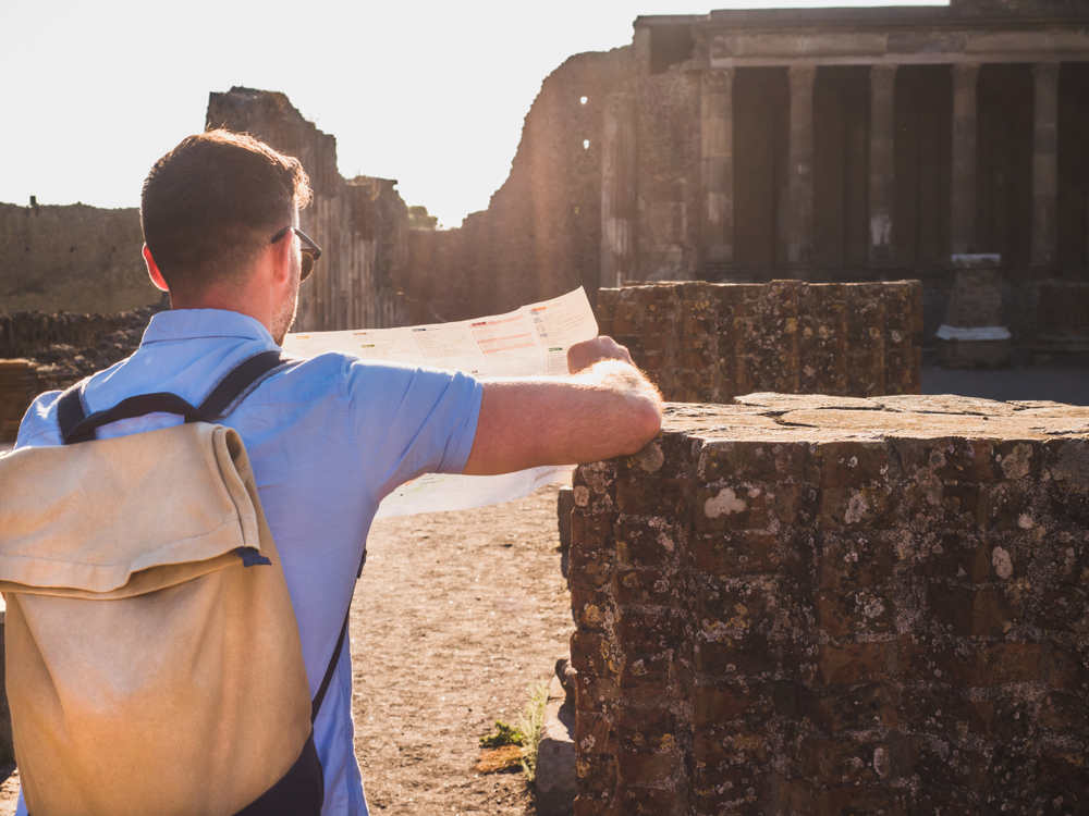 A visitor listening to an audio guide with headphones